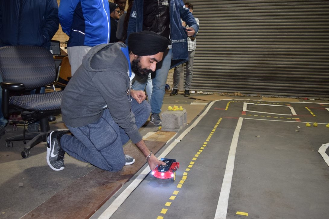 Student getting ready for autonomous vehicle competition