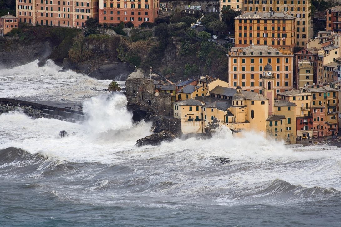 waves crashing into buildings