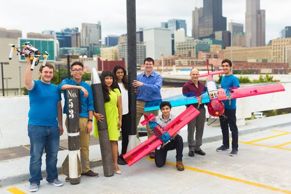 students holding rockets