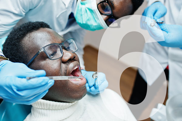 A person getting a cleaning at a dental clinic