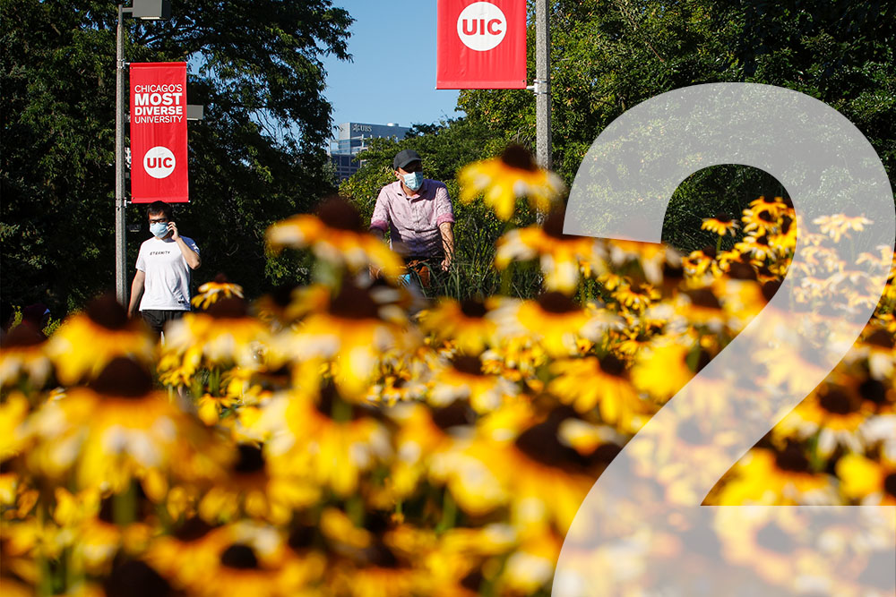 Campus with flowers in the foreground and trees in the background and superimposed number 